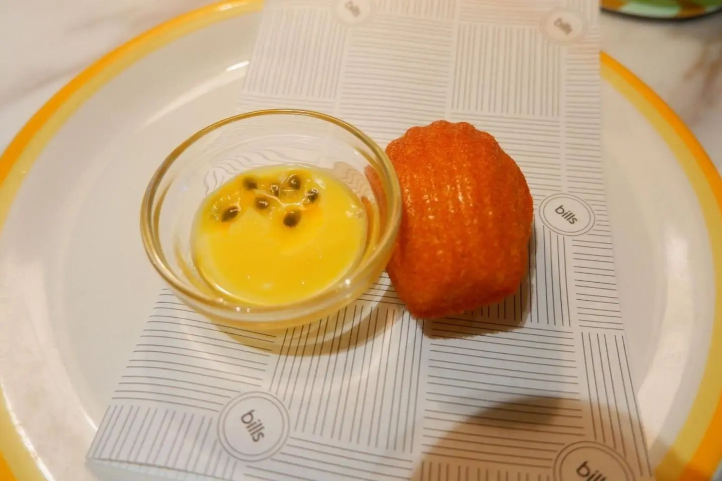 Kinako madeleine, served with salted passionfruit and lime curd