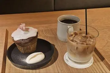 Iced latte, coffee, and a seasonal cherry blossom muffin