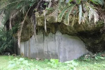 <p>The limestone hills are reinforced by concrete walls in some areas to help slow down erosion</p>