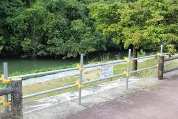 <p>Some of the areas along the Hija River are cordoned off from public access and are presumably awaiting repair</p>