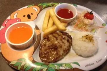 <p>A child's hamburger set with salad</p>