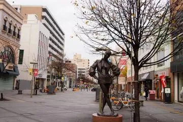 Various statues are placed along the main shopping street.