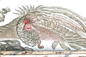 A beautiful carving of the Asian Phoenix in the eaves of the gate