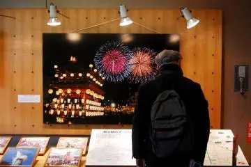 A visitor took a look on photo exhibition