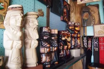 Wooden statues of Ainu men.