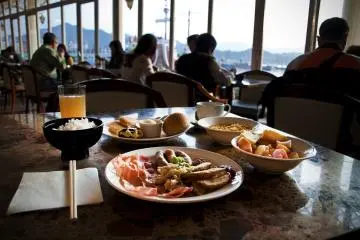 Having breakfast at the Excelsior restaurant overlooking the bay