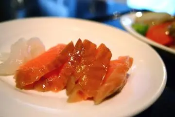Salmon and ika sashimi provided at the breakfast buffet.
