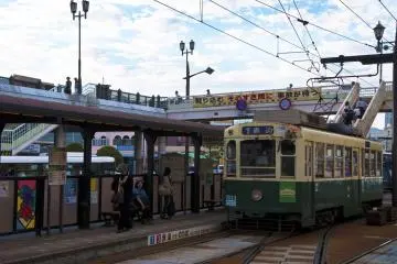 People waiting the streetcar at Nagasaki-Ekimae station during daytime