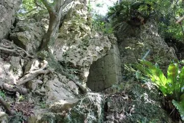 You are near the top once the light through the stone archway can be seen