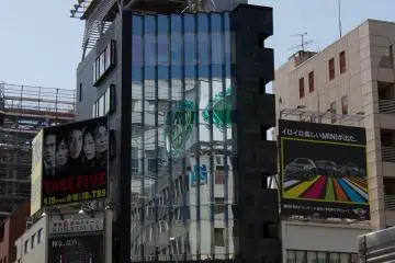 <p>Right on the crossing of Omotesando and Aoyama-dori, the "architecture" of advertising boards is quite impressive, too. You can pass there three times a day and I swear you discover something new every time.</p>