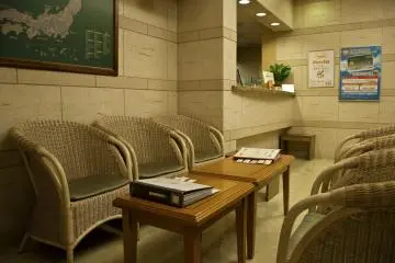<p>Front desk and rest area in the lobby</p>