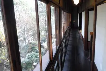 <p>Here is the hall running the length of the house, facing a small courtyard. The view through the old glass appears&nbsp;rippled, such is the quality of old glass.&nbsp;</p>