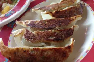 <p>Dragon's gyoza is distinctly crispy on one side; I like to poke a hole into the tender side with my chop sticks&nbsp;to allow the gyoza sauce to fill the inside of the dumpling</p>