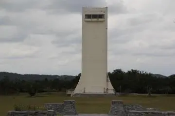 <p>The surrounding recreation area at Kurshiki Dam includes the jogging track and wide open grassy area around the tower</p>
