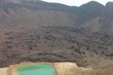 Crater lake filled with waters of a strangely metalic color
