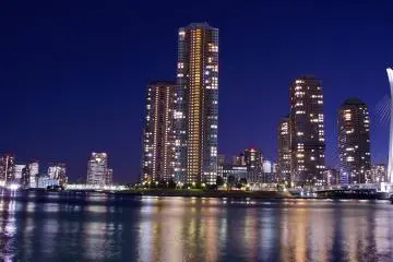 <p>Waterfront and Chuo-Ohashi&nbsp;Bridge with night-time illumination and reflections</p>