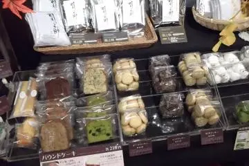 <p>There's a rack of sweets and other goodies for sale</p>