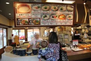 <p>The menu board and display placards are strictly in Japanese, but there is a laminated flyer available that shows all offerings with descriptions in English and Korean</p>
