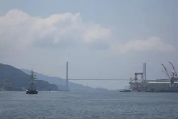 'Megami Ohashi(Venus Wing)' and sailboats inside the port of Nagasaki