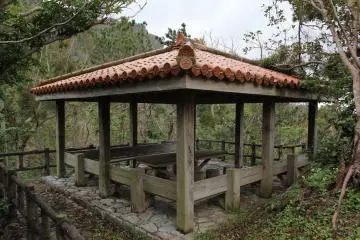 <p>Park trails in the area lead to this resting point; the Ryukyuan red tile roofed structure seats about 20 but doesn't offer great views of the area due to the many surrounding trees and the slope of the hills</p>