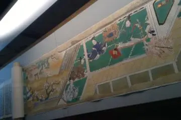 <p>A painted scroll spread out on display&nbsp;at the Kita City Asukayama Museum.</p>