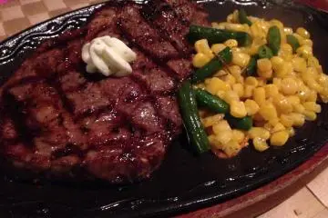 <p>The ribeye steak dinner comes with a sizeable portion of beef and vegetable of the day</p>