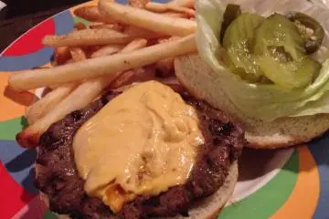 <p>The Cajun Burger is more Tex-Mex than New Orleans, it's a large all beef patty that comes with pico de gallo, jalapeno cheese, jalapeno slices, condiments, and fries&nbsp;</p>