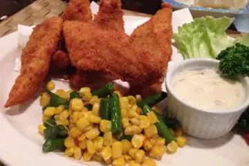 <p>The fried Alaskan pollack with tartar sauce and vegetables; all entrees include tea or coffee</p>