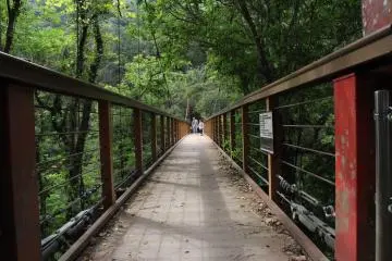<p>When first entering the suspension bridge on the way to the waterfall turn around from this perspective and look uphill to see a hidden view point along the terrain finger that separates the Hiji&nbsp;River and other rivers that descend&nbsp;from nearby Mount Yohana</p>
