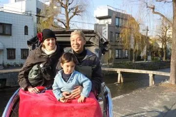 <p>Our family in the rickshaw at the end of our 10 minute odyssey</p>