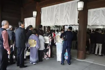 Waiting to be blessed by the head priest.