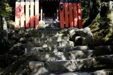 Massive stone steps leading to a small altar