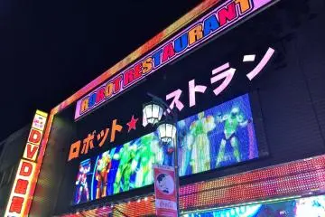 <p>At the entrance of the Robot Restaurant, top of the building</p>