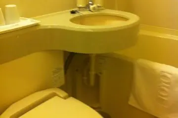 Bathroom with washlet and combined shower bath