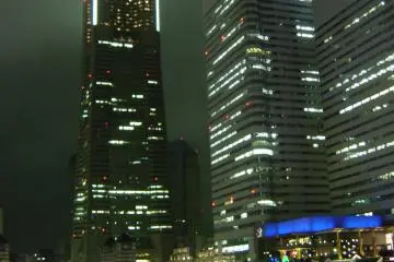 <p>View of the Landmark Tower on a rainy night, as seen from the Cosmo World Amusement Park</p>