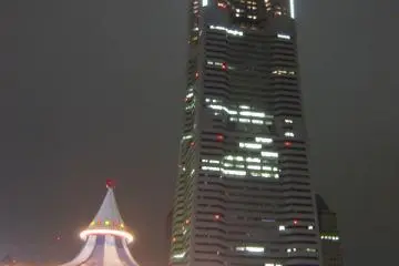 <p>Entertainment rides at the&nbsp;Cosmo World Amusement Park with the Landmark Tower in the background</p>