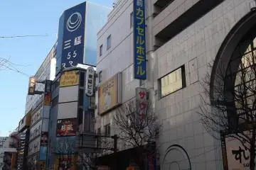 <p>This is where you'll find it; the entrance is under that narrow vertical blue sign in the middle</p>