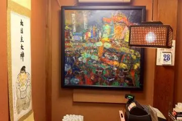 The cash register, with an amazing painting of the Saijo Festival (Photo: Bret de Colebi)
