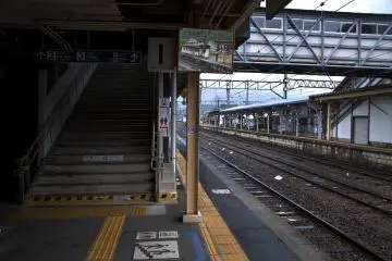 Stairs, train tracks, mirrors, connecting bridges and platforms at Arita&nbsp;station