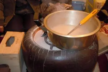 <p>Boiling more amaezake (sweet alcohol).</p>