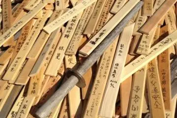 Wooden swords cover the warriors grave.