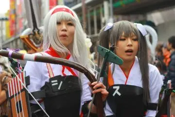 Photo:  "Kantai Collection" cosplayers @ Nipponbashi Street Festa 2014, Osaka. – <a href="https://commons.wikimedia.org/wiki/File:KanColle_Cosplay.jpg" target="_blank" rel="noreferrer noopener nofollow">Japanexperterna.se</a> / <a href="https://creativecommons.org/licenses/by-sa/2.0/" target="_blank" rel="noreferrer noopener nofollow">CC BY-SA 2.0</a>